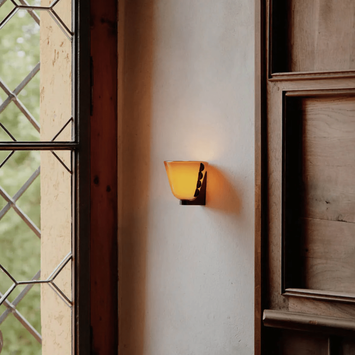 Velora Sculptural Wall Sconce in Matte Gold with Glass Shade