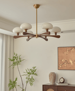 Evander Ray Modern Wood and Brass Chandelier with Glass Shades