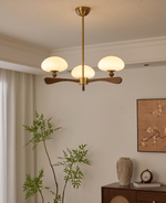 Evander Ray Modern Wood and Brass Chandelier with Glass Shades