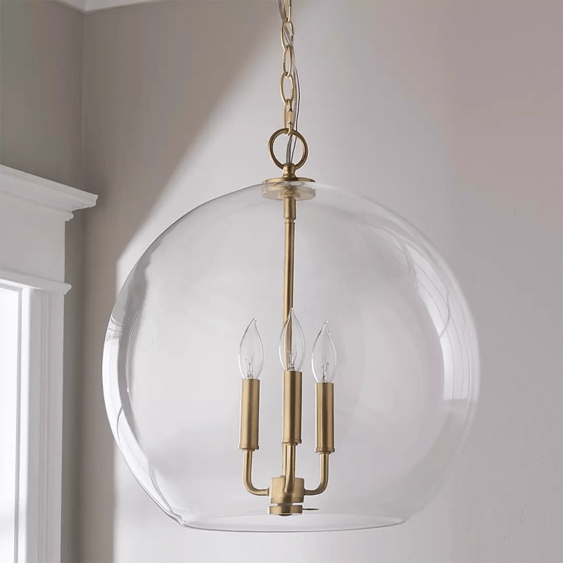 Lysander Clear Glass Globe Pendant Light in Aged Brass