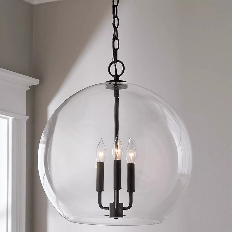 Lysander Clear Glass Globe Pendant Light in Aged Brass