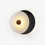 Lunara Textured Disc Wall Sconce in Black Travertine and Frosted Glass