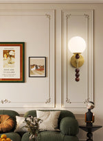 Colette Globe Wall Sconce in Gold or Walnut | Modern Luxury Lighting