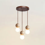Camille Travertine Pendant Light – Natural Stone Sphere with Opal Glass Globe