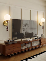 Colette Globe Wall Sconce in Gold or Walnut | Modern Luxury Lighting