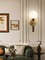 Colette Globe Wall Sconce in Gold or Walnut | Modern Luxury Lighting