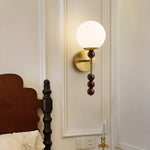 Colette Globe Wall Sconce in Gold or Walnut | Modern Luxury Lighting