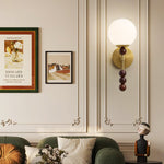 Colette Globe Wall Sconce in Gold or Walnut | Modern Luxury Lighting