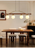 Adorned Linear Chandelier in Walnut and Brass with Glass Orbs