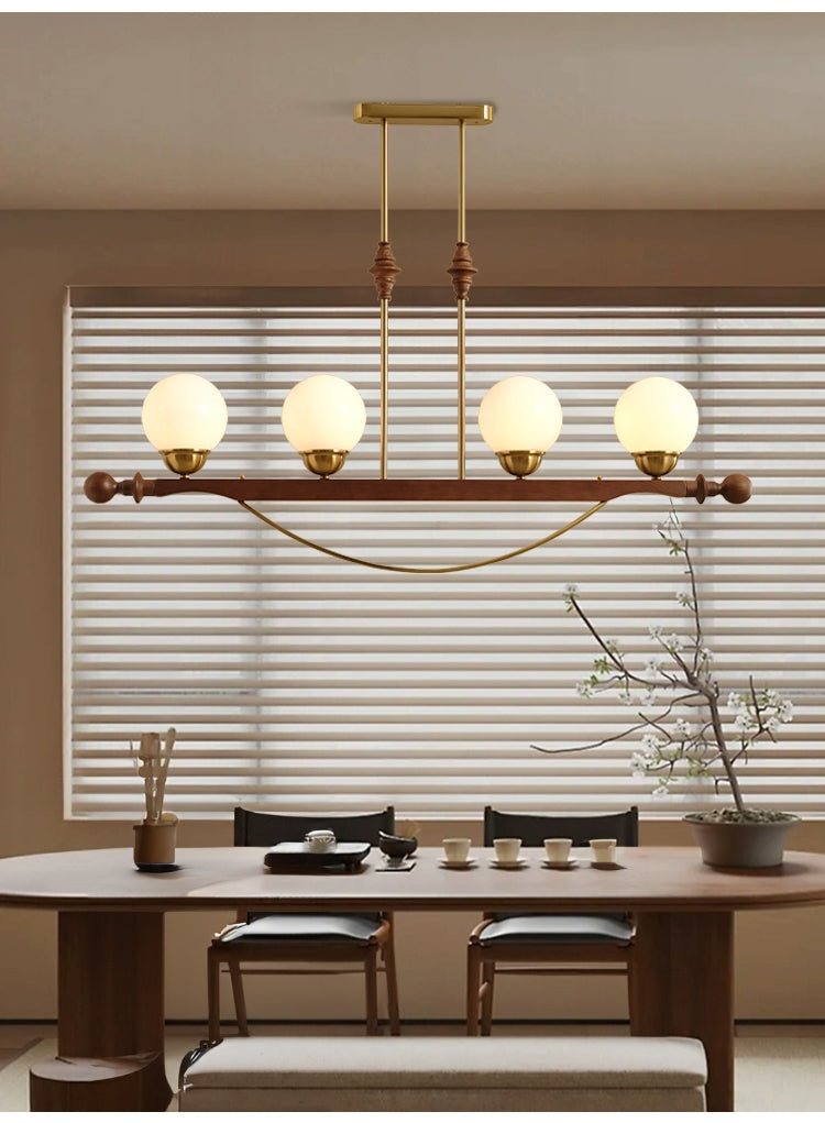 Adorned Linear Chandelier in Walnut and Brass with Glass Orbs