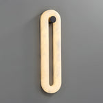 Alabaster Capsule Wall Sconce in Natural Stone with Black Mount
