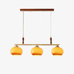 Amber Trio Pendant Light – Brass & Wood Linear Chandelier