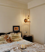 Amberveil Bloom Wall Sconce with Amber Glass Shade and Brass Accents