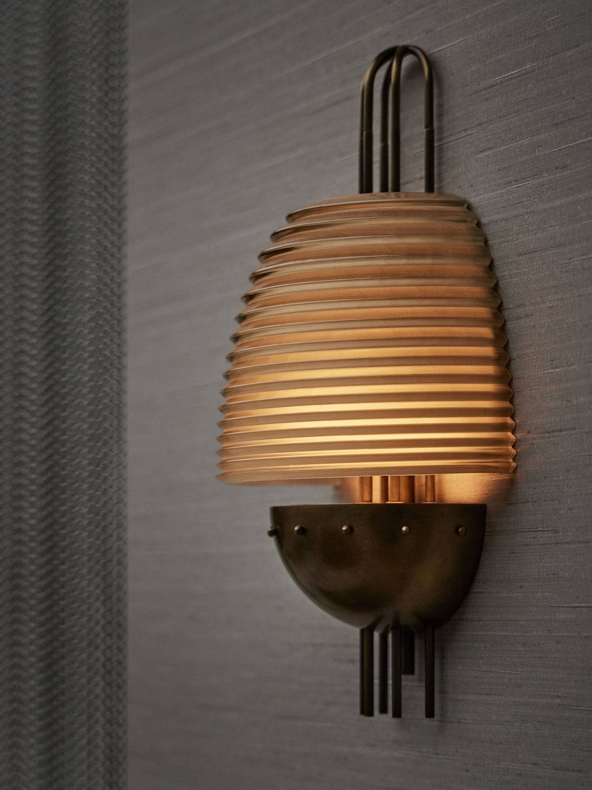 Arclune Ribbed Wall Sconce in Bronze with Amber Glass