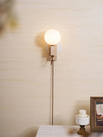 Atlas Globe Wall Sconce in Travertine and Opal Glass