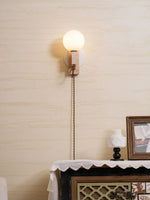 Atlas Globe Wall Sconce in Travertine and Opal Glass