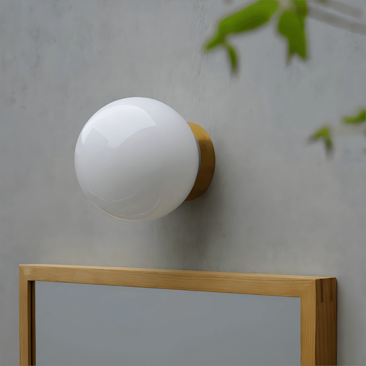 Aura Globe Glass Wall Sconce in Brass for Modern Interiors