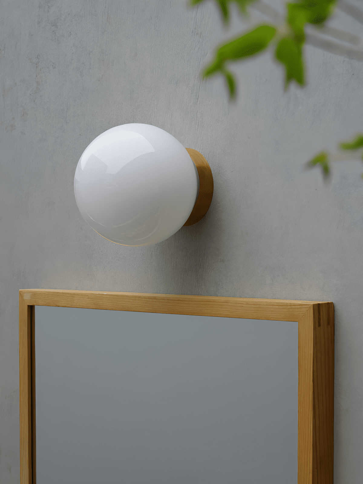 Aura Globe Glass Wall Sconce in Brass for Modern Interiors