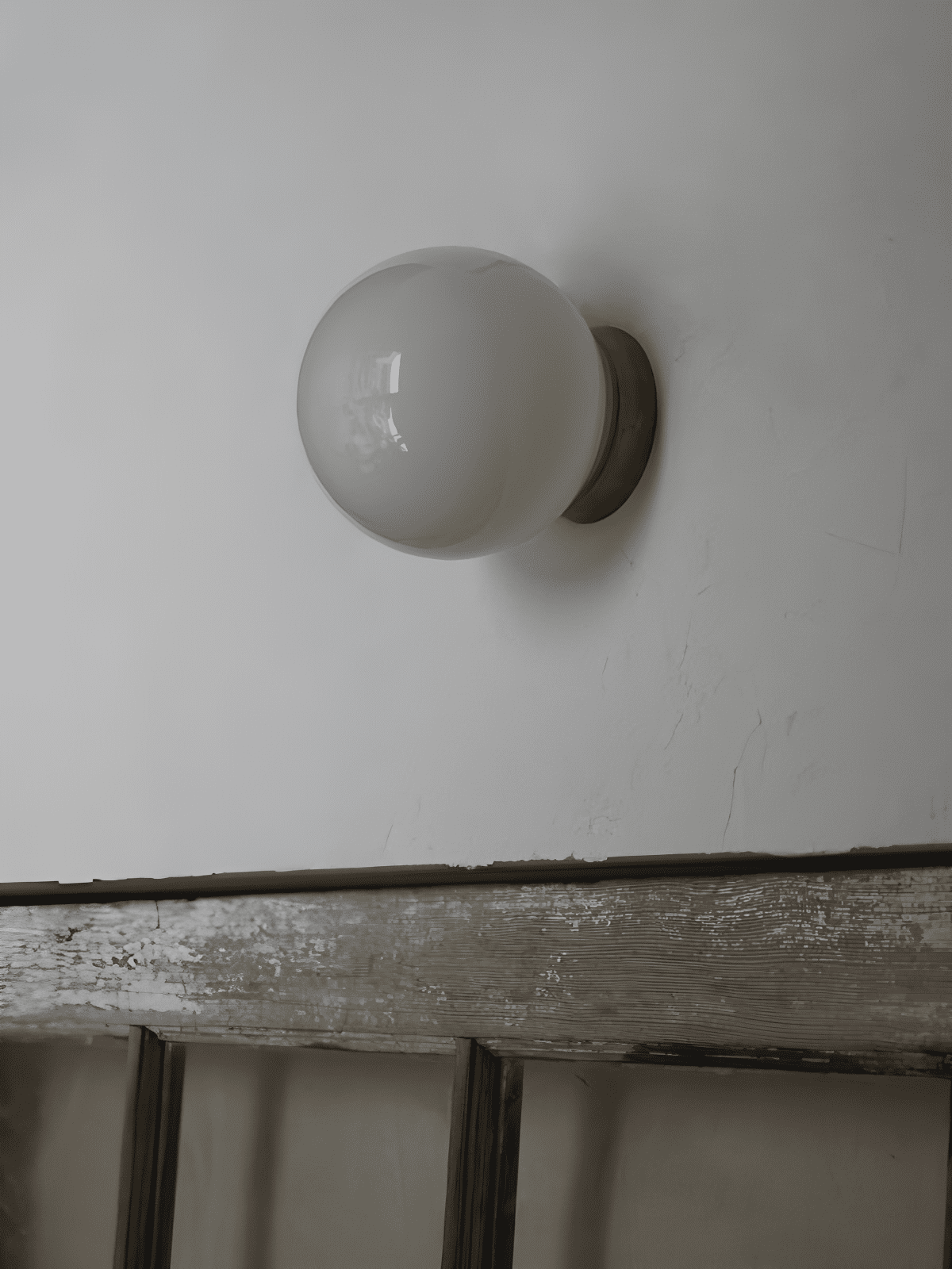Aura Globe Glass Wall Sconce in Brass for Modern Interiors