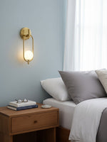 Aurea Brass Wall Sconce – Modern Minimalist Oval Glass Wall Light