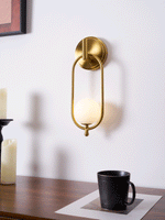 Aurea Brass Wall Sconce – Modern Minimalist Oval Glass Wall Light