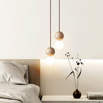Camille Travertine Pendant Light – Natural Stone Sphere with Opal Glass Globe