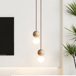 Camille Travertine Pendant Light – Natural Stone Sphere with Opal Glass Globe