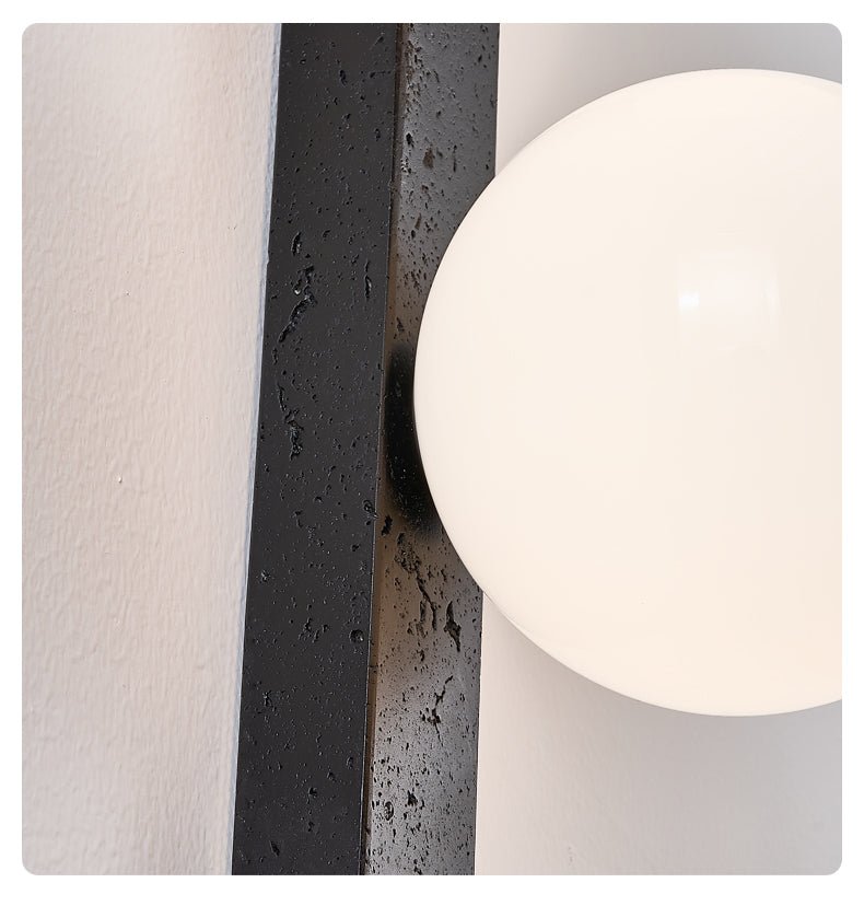 Balanced Globe Wall Sconce in Black Travertine and Opal Glass