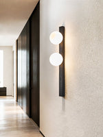 Balanced Globe Wall Sconce in Black Travertine and Opal Glass