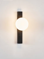 Balanced Globe Wall Sconce in Black Travertine and Opal Glass