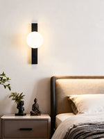 Balanced Globe Wall Sconce in Black Travertine and Opal Glass