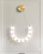 bead-cascade-loop-wall-lamp