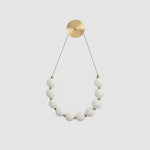 bead-cascade-loop-wall-lamp