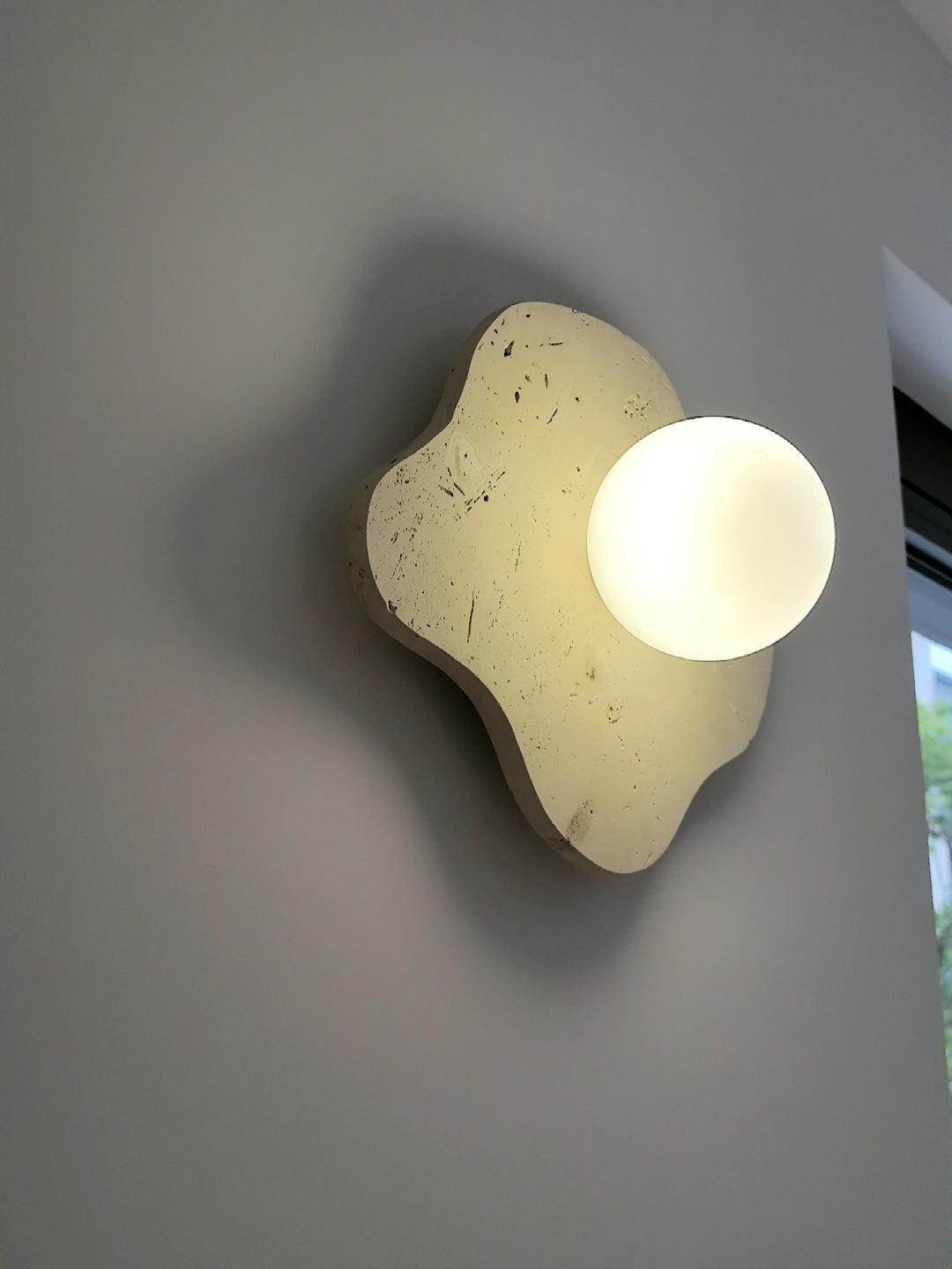 blob-travertine-wall-lamp
