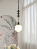 Bola Modern Pendant Light with Opal Glass Globe and Black Spheres