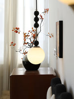 Bola Modern Pendant Light with Opal Glass Globe and Black Spheres