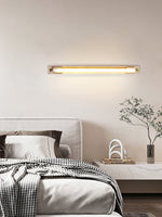 Caelum Linear LED Wall Sconce in Travertine and Bronze