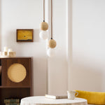 Camille Travertine Pendant Light – Natural Stone Sphere with Opal Glass Globe