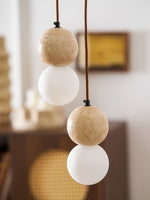 Camille Travertine Pendant Light – Natural Stone Sphere with Opal Glass Globe