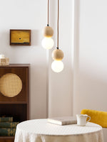 Camille Travertine Pendant Light – Natural Stone Sphere with Opal Glass Globe