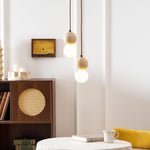 Camille Travertine Pendant Light – Natural Stone Sphere with Opal Glass Globe