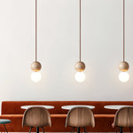 Camille Travertine Pendant Light – Natural Stone Sphere with Opal Glass Globe