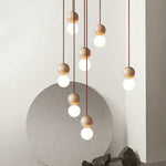 Camille Travertine Pendant Light – Natural Stone Sphere with Opal Glass Globe