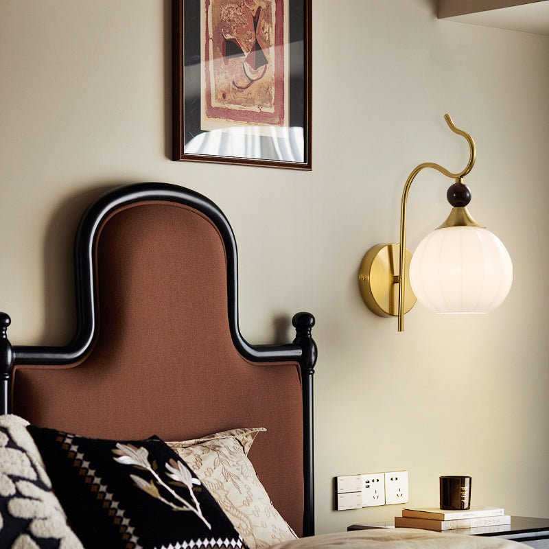 Celeste Curved Wall Sconce in Gold or Black with Pleated Glass Shade