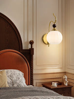 Celeste Curved Wall Sconce in Gold or Black with Pleated Glass Shade