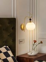 Celeste Curved Wall Sconce in Gold or Black with Pleated Glass Shade