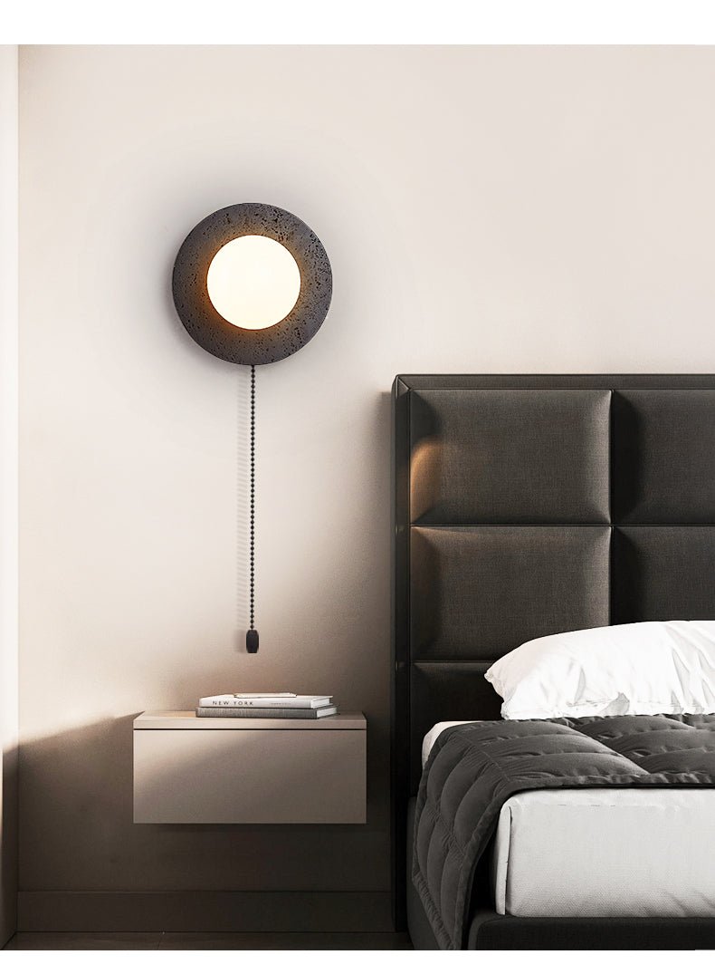 Crater Backlit Wall Sconce in Black Travertine with Opal Glass Globe