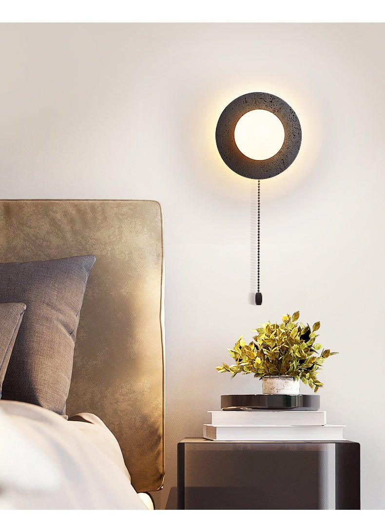 Crater Backlit Wall Sconce in Black Travertine with Opal Glass Globe