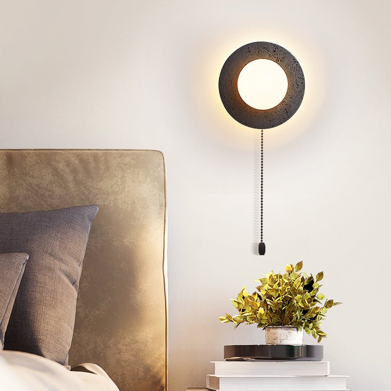 Crater Backlit Wall Sconce in Black Travertine with Opal Glass Globe
