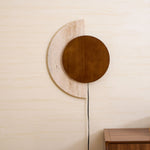 Crescent Halo Plug-In Wall Sconce in Natural Travertine and Wood